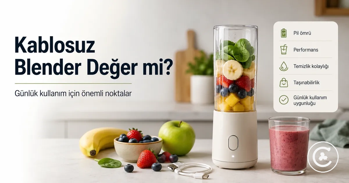 Meyve, bardak ve şarj kablosu yanında günlük smoothie hazırlayan kablosuz blender